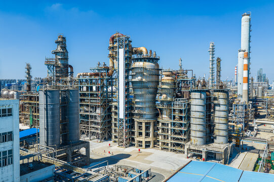 Modern large-scale petrochemical industrial plants and refinery facilities under a blue sky in China