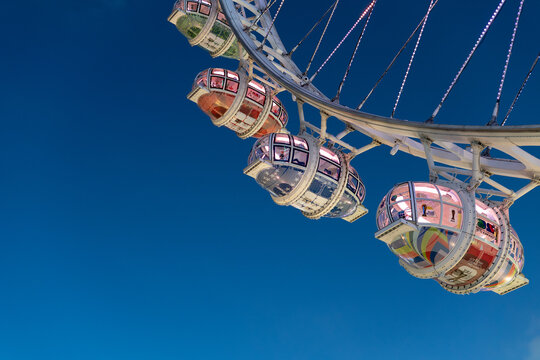 Gondolas on The Bay Glory observation wheel at blue hour