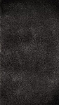 Dark Film Grain Texture. Flickering black grain and cloudy marks create a moving vintage film background. 