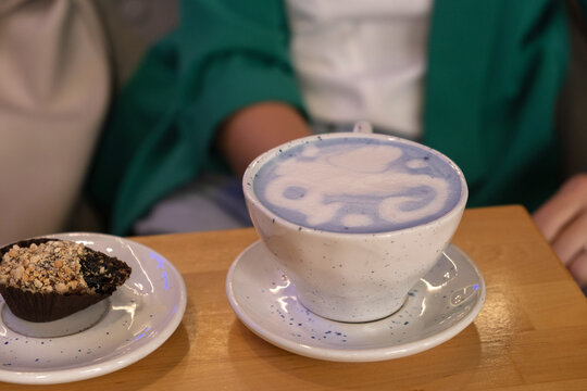 Coffee and dessert together in a cozy cafe setting during the afternoon