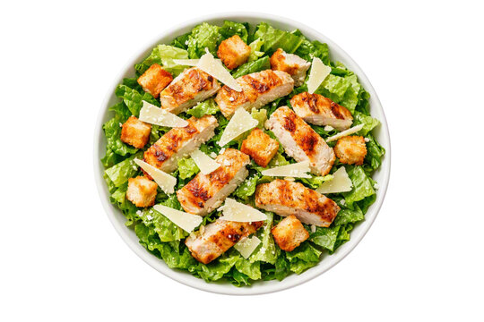 Fresh Caesar salad with grilled chicken, crispy croutons, and Parmesan cheese on green romaine lettuce. Isolated on transparent background. Restaurant menus, healthy food ads, or packaging.