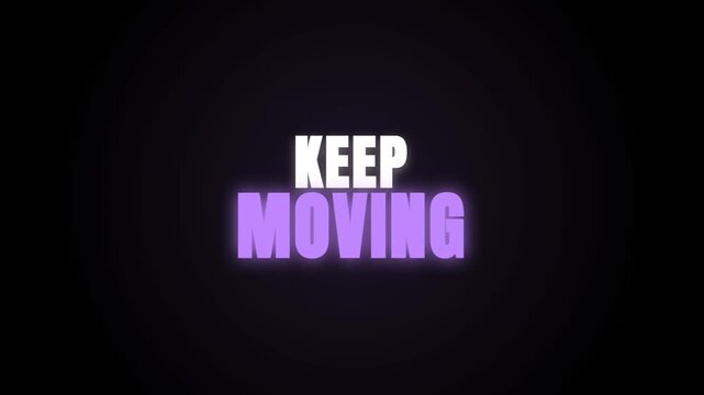 A motivational video display featuring the phrase 'KEEP MOVING' in bold, glowing white and purple typography against a dark black background, encouraging persistence and focus.