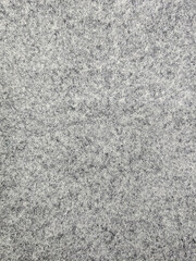 Grey felt fabric texture background close up © AriePramz
