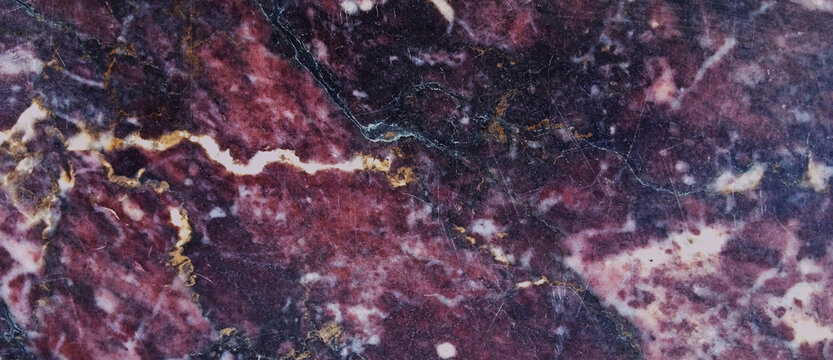 Deep purple marble texture with gold veins, luxury dark stone background, elegant polished granite surface for interior design