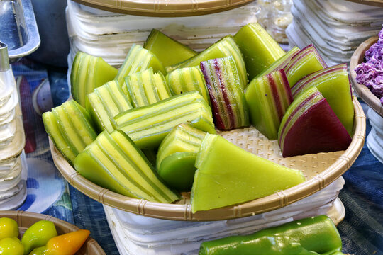 Traditional Vietnamese Banh Da Lon Steamed Layer Cake Sweet Dessert Displayed in a Market Basket