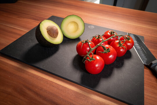 Ripe Avocado and Red Tomatoes Ready for Preparation