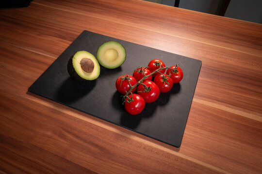 Fresh Avocado Halves and Cherry Tomatoes Still Life