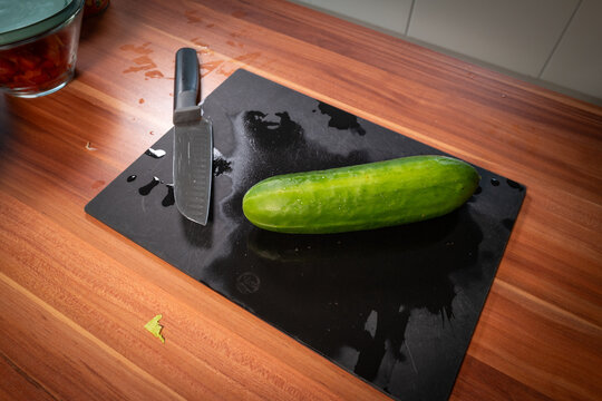 Whole Green Cucumber Ready for Cutting in Kitchen