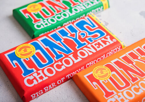LONDON, UK - MAY 28, 2026: Assorted Tony's chocolonely milk chocolate bars on light table top background.