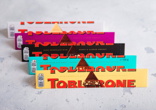 LONDON, UK - APRIL 05, 2026: Various Toblerone Swiss chocolate bars on light table top.