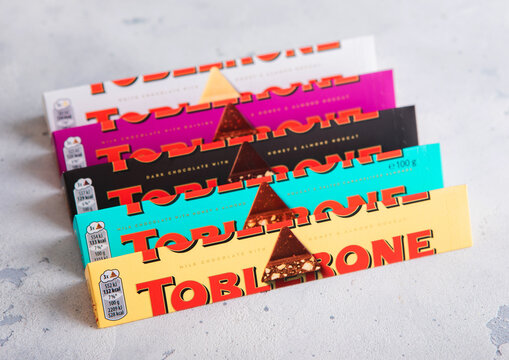 LONDON, UK - APRIL 21, 2026: Various Toblerone Swiss chocolate bars on light table top.