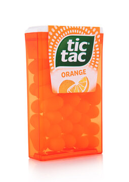 LONDON,UK - SEPTEMBER 10,2025: Tic Tac orange flavour drage candies in original plastic container on white background.
