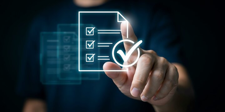 Businessman touching digital checklist icon for quality assurance and task management.