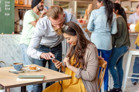 Friendly cafe interaction scene photo