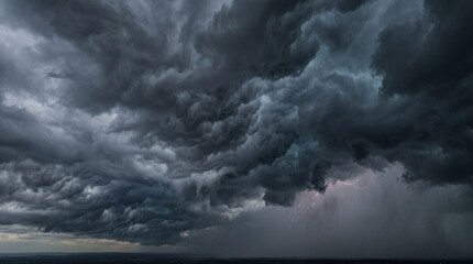 Obraz premium Dark ominous storm clouds with lightning strike in the distance