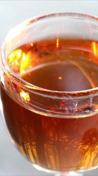A close-up shot of a glass of wine sitting on a table, perfect for editorial or commercial use