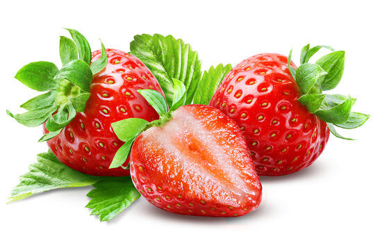 Sliced strawberry half placed in front of two whole berries with green leaves and sepals isolated on transparent background.