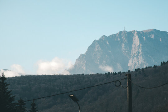 Caraiman Peak and Heroes Cross Rising Above Forest in Bucegi Mountains