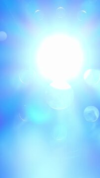 Real Volumetric Blue Light Beams. Camera-captured blue beams and glowing flares move through haze against a dark background.