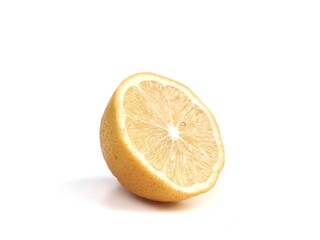 Naklejka premium Fresh half sliced yellow lemon fruit showing juicy pulp isolated on a solid white background. Ideal for food, beverage, health, citrus, culinary, and organic product design projects