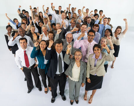 Diverse group of professionals celebrating success together.