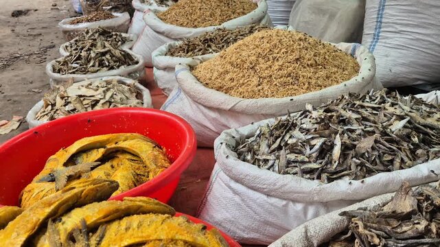 Assorted Dried Fish Variety Displayed In Sacks At Local Seafood Market Close Up