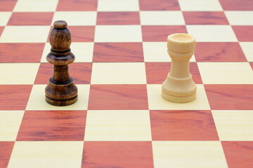 Wooden chess board. Black bishop and white rook. © Martin of Sweden