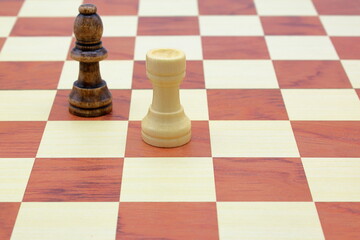 Wooden chess board. Black bishop and white rook. © Martin of Sweden