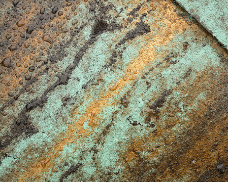 Weathered Copper Roof With Turquoise Patina and Raindrops