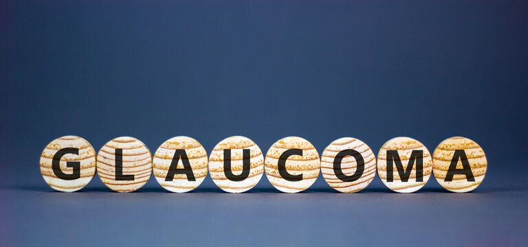 Glaucoma word symbol. Concept word Glaucoma on beautiful wooden circles. Beautiful grey background. Medical support help glaucoma word concept. Copy space.