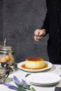 Homemade Caramel Flan Dessert Served on White Plate With Spoon and Vintage Tableware