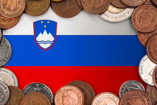 Coins on flag of Slovenia trading investment business currency concept
