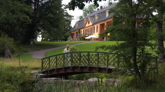 Woman on a bridge in the park