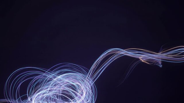 Abstract light trails in slow motion on dark background for creative design