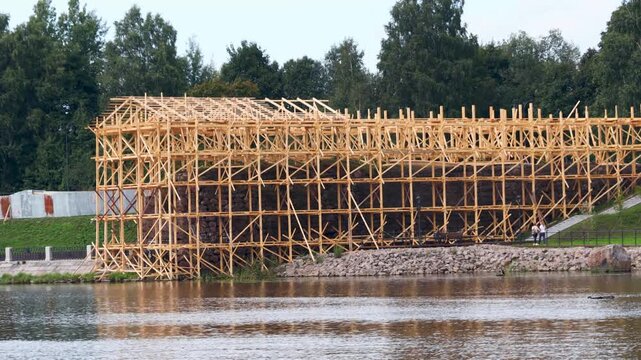 A wooden structure built over a body of water, suitable for use as a pier or dock