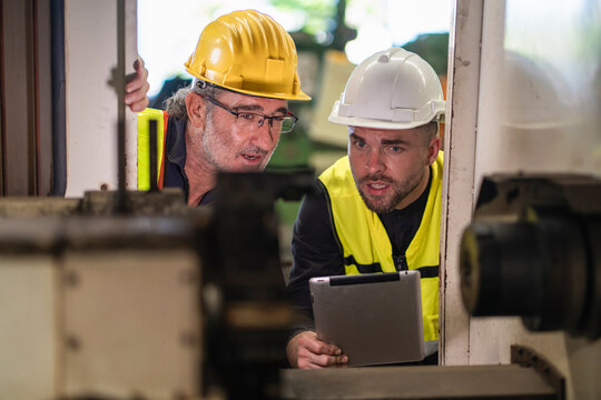 Workers Factory or Engineering work at factory site check up machine or products in site. Foreman or Technician checking Material or Machine on Plant. Heavy industry factory concept.