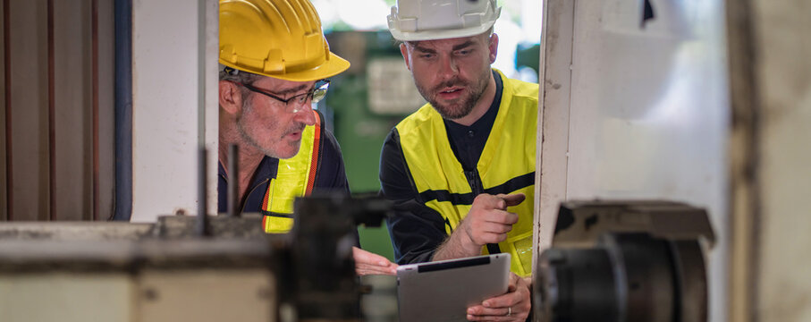Workers Factory or Engineering work at factory site check up machine or products in site. Foreman or Technician checking Material or Machine on Plant. Heavy industry factory concept.