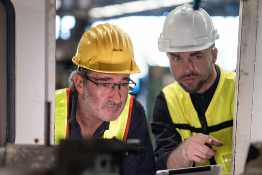 Workers Factory or Engineering work at factory site check up machine or products in site. Foreman or Technician checking Material or Machine on Plant. Heavy industry factory concept.