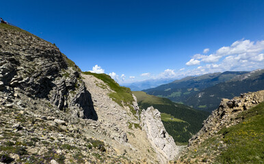 Fototapeta premium Mountain landscape panorama seceda and Mount Pic against a blue summer background. 