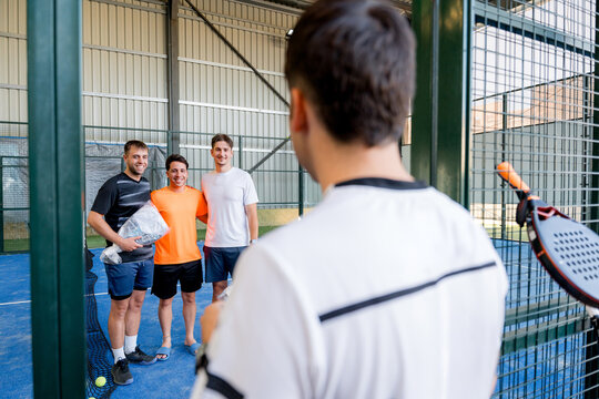 Photographing padel tournament winners on indoor court