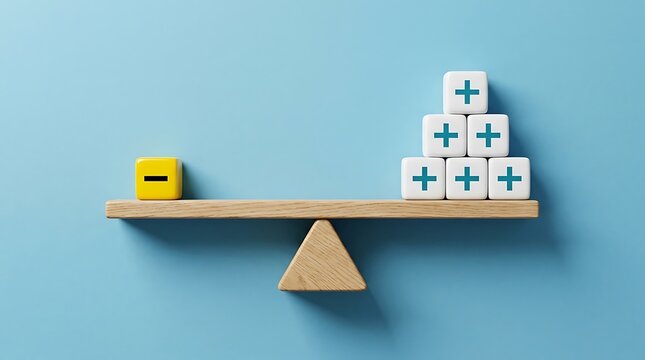 Wooden scale balancing a minus sign against a stack of plus signs on blue background