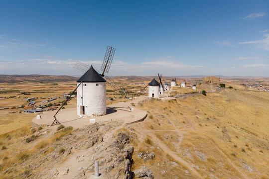Windmills of Consuegra overlooking La Mancha landscape