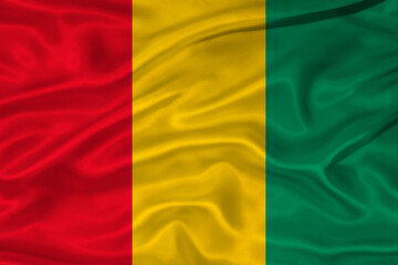 Flag of Guinea with a soft fabric texture. Guinean flag textured with fabric background © YanlethRivera