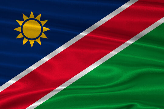 Namibian flag textured with fabric background. Flag of Namibia with a soft fabric texture