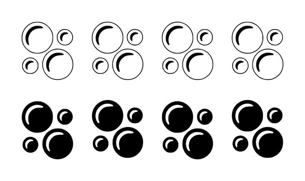 A collection of black and white bubble arranged in rows, featuring both outline and solid circle