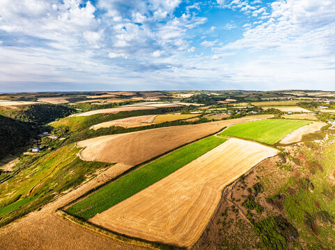 Cliffs and Farms over North Devon and Cornwall Coastpath Border from a drone, Welcombe Mouth Beach, Devon, Cornwall, England, Summer 2026