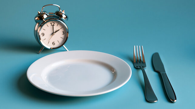 intermittent fasting concept with an empty white plate, clock and cutlery displayed on a bright pastel blue background, nutrition timing concept, bright, with copy space