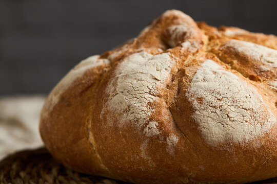Rustic artisan bread loaf with flour dusted crust