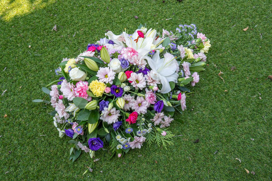 Funeral Floral Spray Tribute on Green Grass Lawn