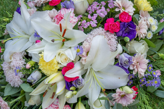 Close Up Funeral Floral Spray Tribute with White Lilies